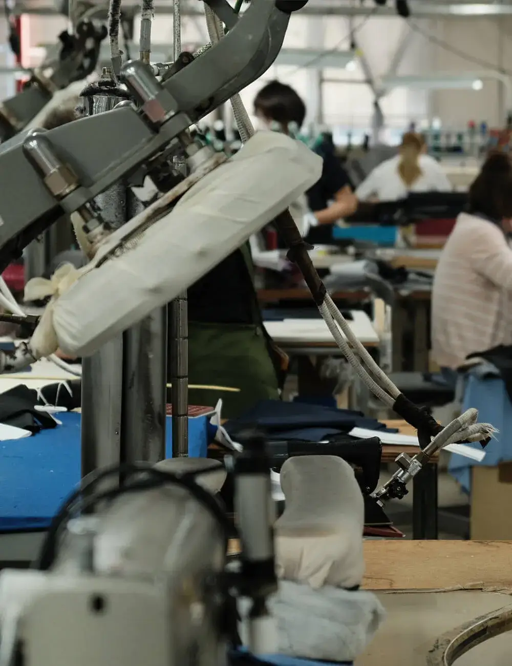 Industrial sewing machines in operation at the partner factory in Japan